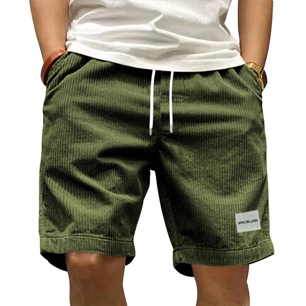 A collection of men's casual shorts in various colors including beige, black, blue, green, khaki, and more, featuring a mid-waist rise and a straight leg cut.