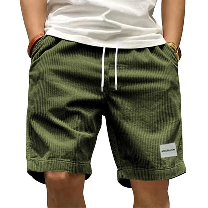 A collection of men's casual shorts in various colors including beige, black, blue, green, khaki, and more, featuring a mid-waist rise and a straight leg cut.