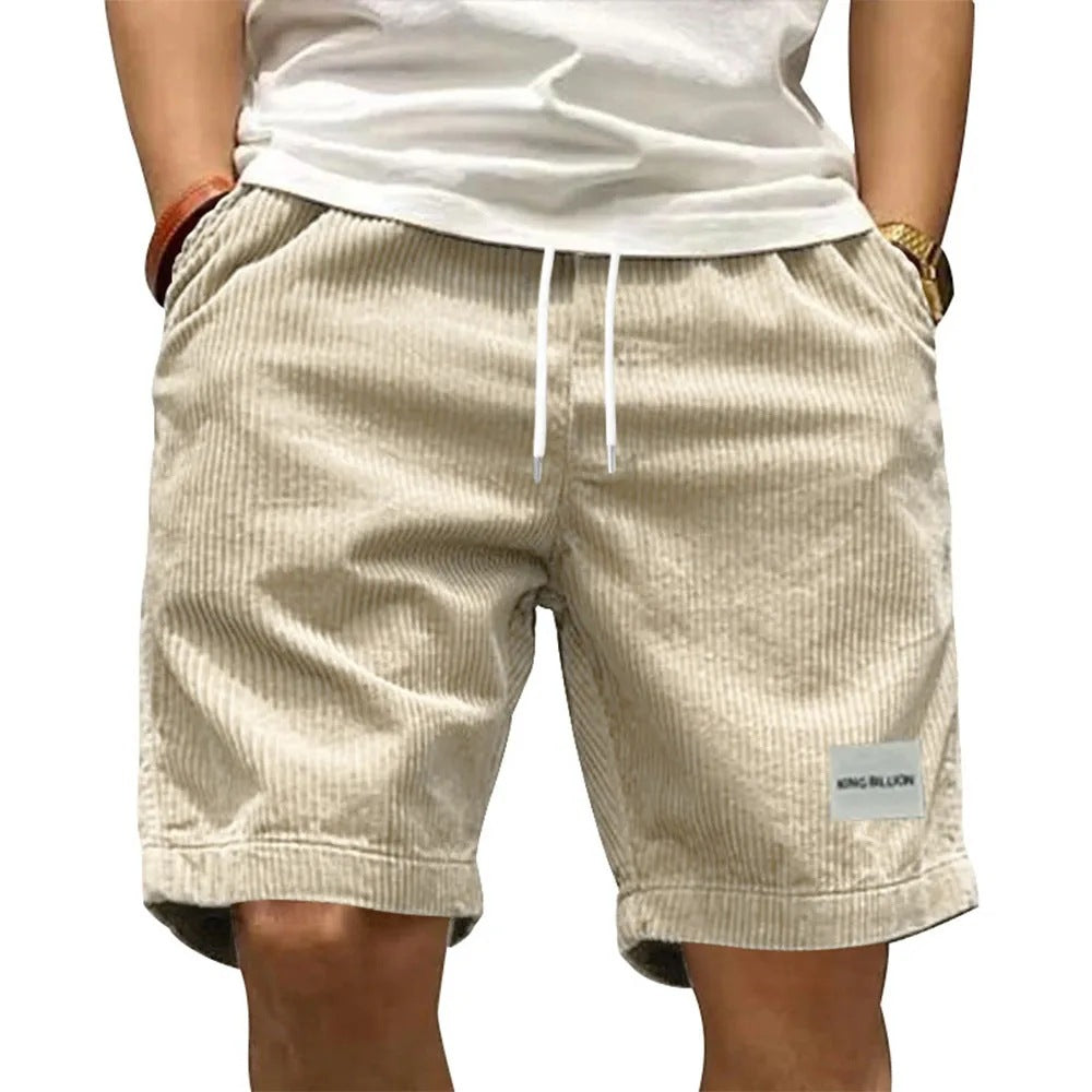 A collection of men's casual shorts in various colors including beige, black, blue, green, khaki, and more, featuring a mid-waist rise and a straight leg cut.