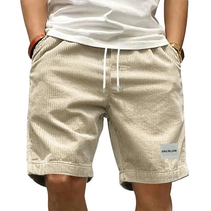 A collection of men's casual shorts in various colors including beige, black, blue, green, khaki, and more, featuring a mid-waist rise and a straight leg cut.