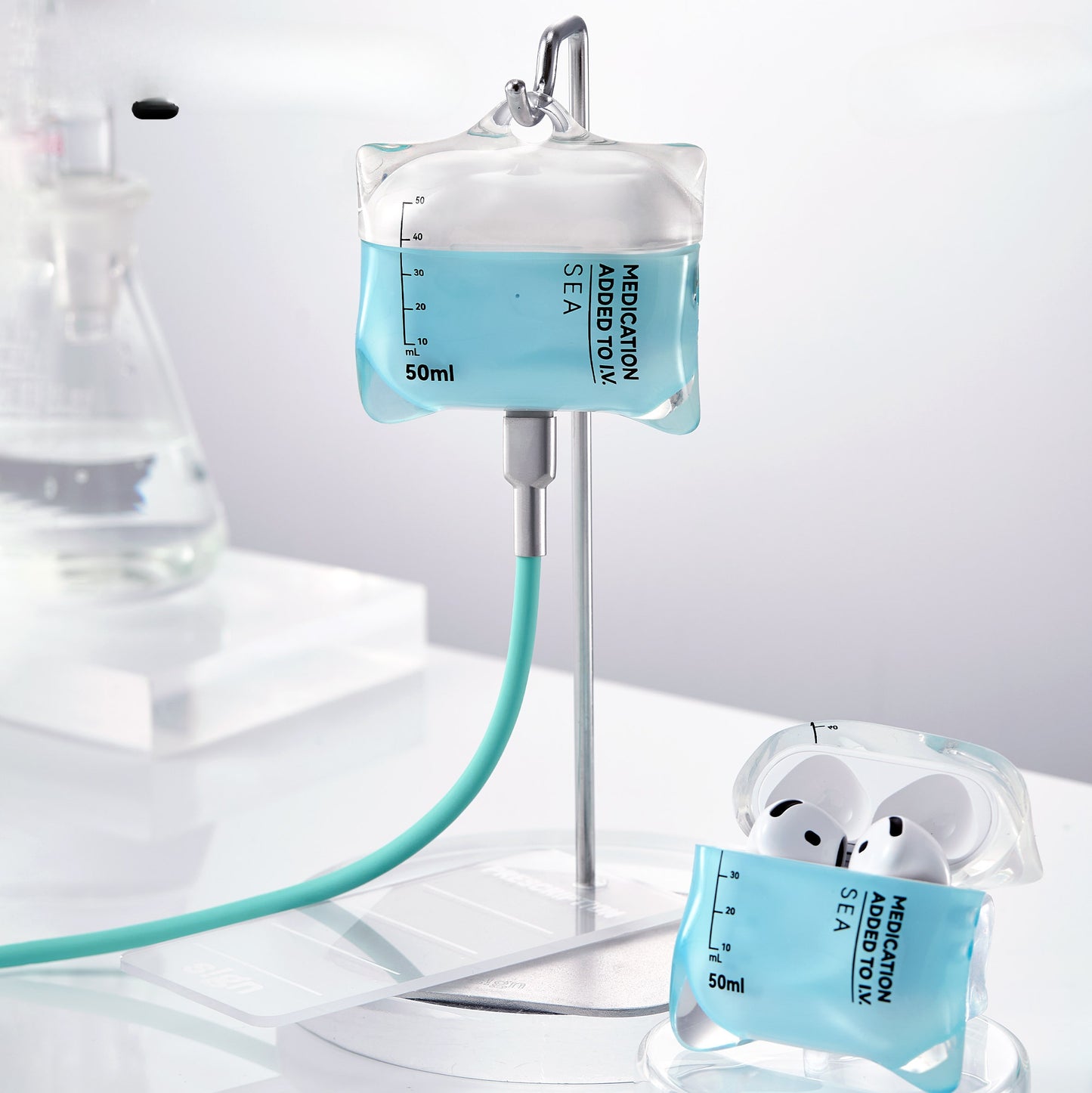 Intravenous bag with a hose and a container labeled 'Medication' on a white background