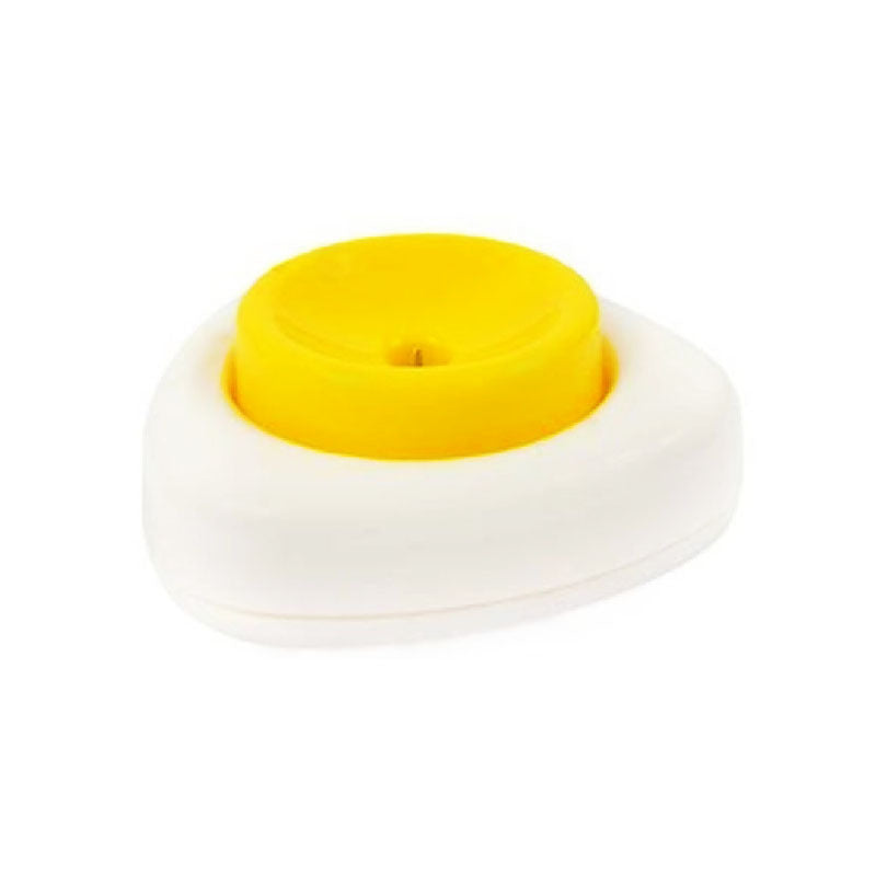 Yellow circular object on a white base with a white background