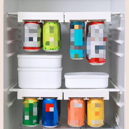 Colorful cans with pixelated designs inside a refrigerator.