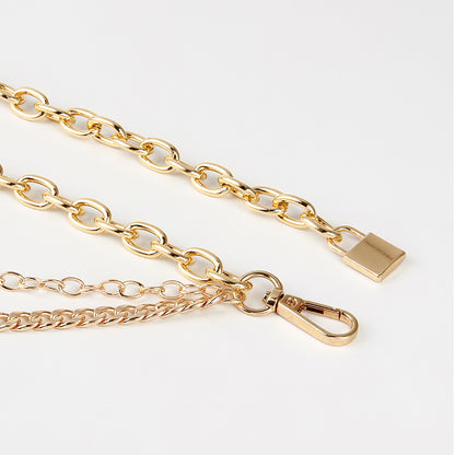 Gold chain with clasp on white background