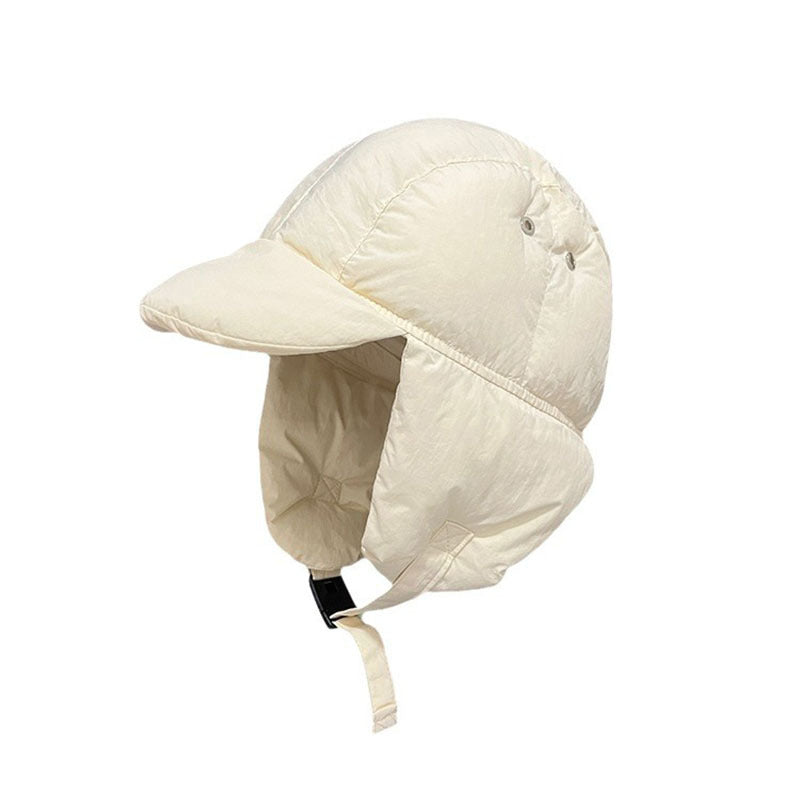 Beige quilted cap with ear flaps on a white background