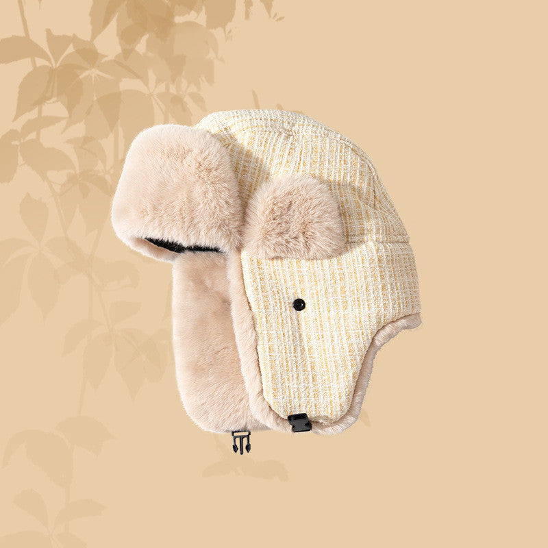 Beige ear-protecting Lei Feng hat with fluffy ear covers on a beige background