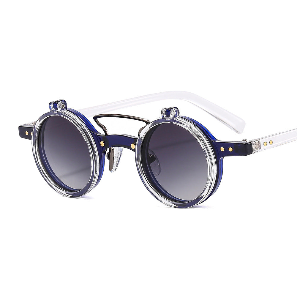 Round sunglasses with blue gradient lenses and clear frame on a white background