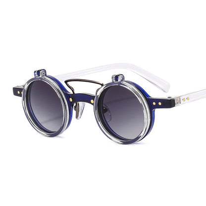 Round sunglasses with blue gradient lenses and clear frame on a white background
