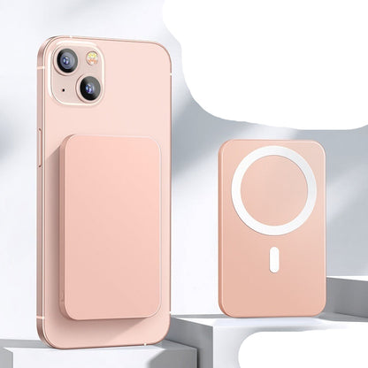 Pink phone case with MagSafe feature and power bank on a white background