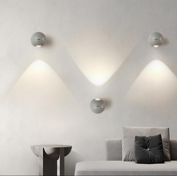 Modern living room with wall-mounted lights creating a personalized lighting space.