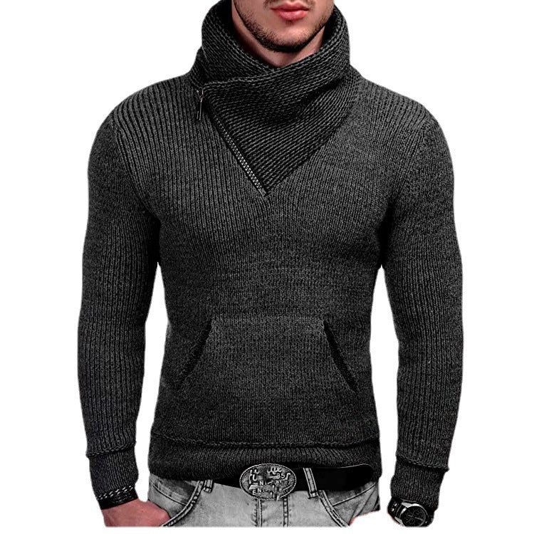 Dark gray knitted sweater worn by a person on a white background