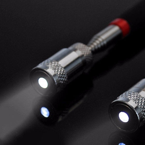 Close-up of a pen with LED lights on a dark background