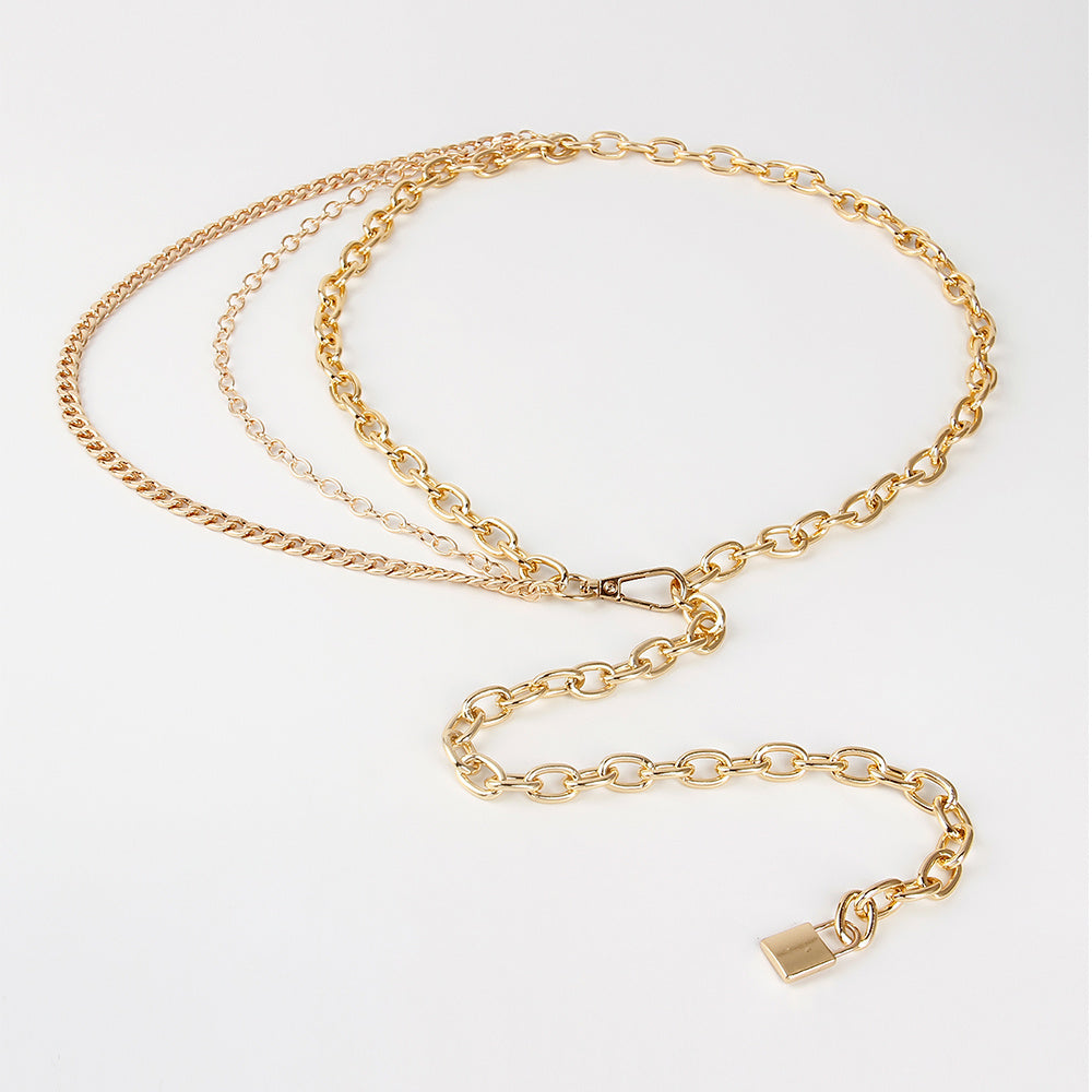 Gold chain necklace on a white background