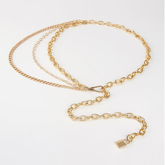 Gold chain necklace on a white background