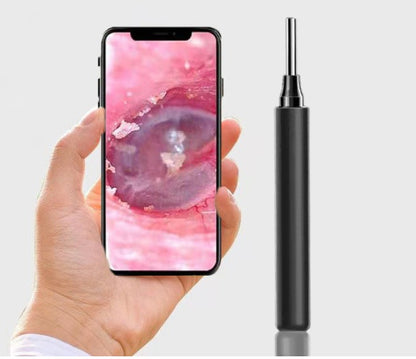 Hand holding a smartphone with a pink and purple abstract wallpaper, next to a black and silver pen-like device on a white background.