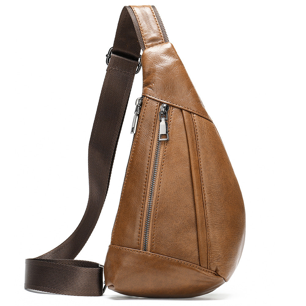 Brown leather sling bag with a strap on a white background
