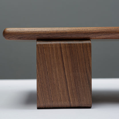 Wooden bench with a simple design on a neutral background