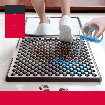 Person using a cleaning mat with a blue cleaning solution being poured over it.