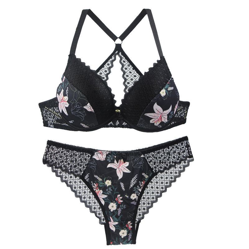 Black floral lingerie set with lace details on a white background