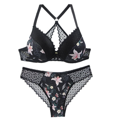 Black floral lingerie set with lace details on a white background
