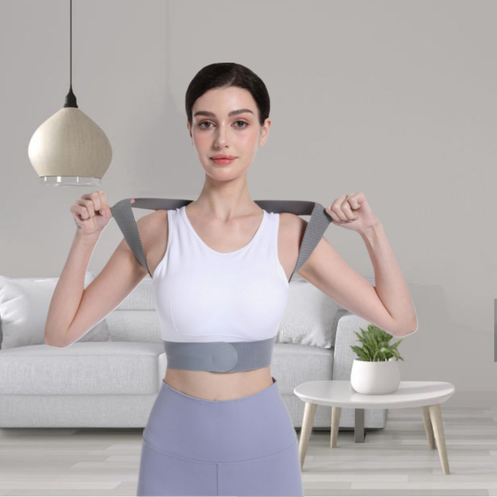 Woman wearing a back brace in a living room setting