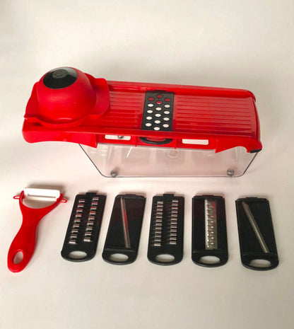 Red mandoline slicer with interchangeable blades on a white background