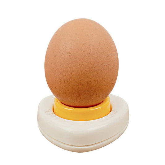 Brown egg on a white and yellow egg holder against a white background
