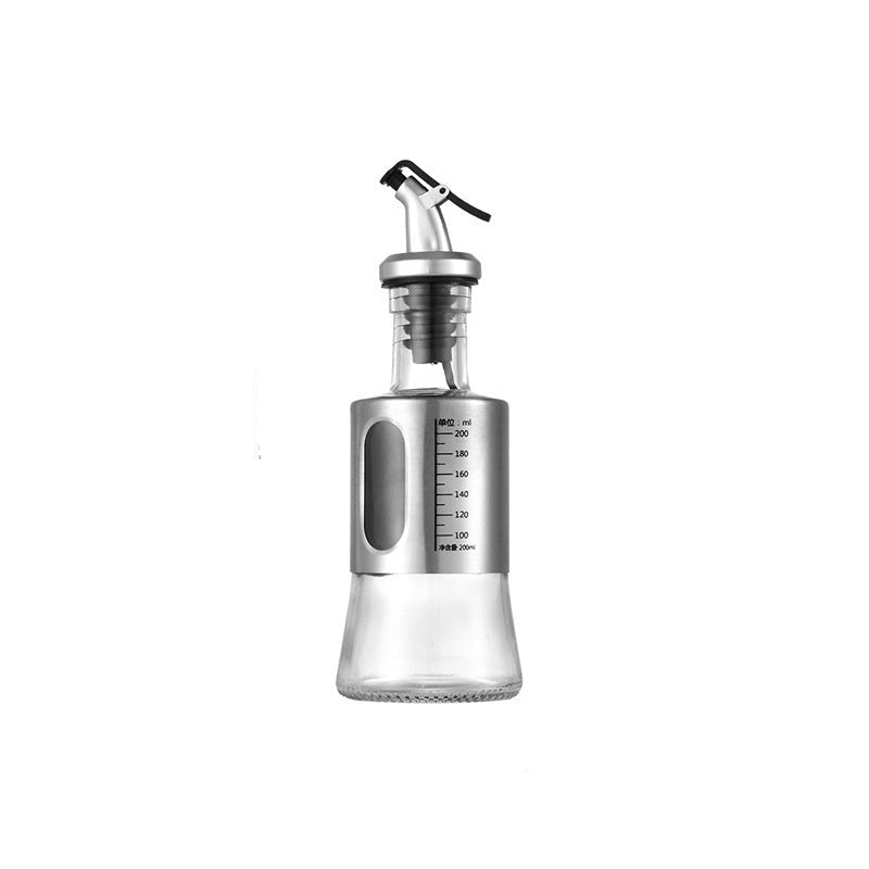 Silver oil bottle with measurement markings on a white background