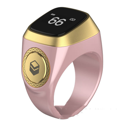 Smart ring with gold and pink design on a white background