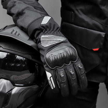 Black motorcycle glove with textured palm design on a blurred background