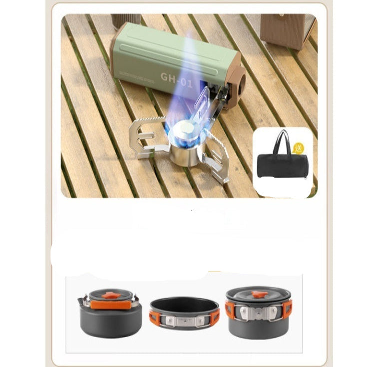 Portable cassette stove with accessories on a wooden surface