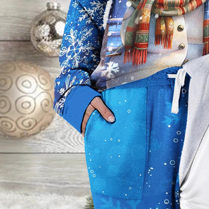 Person wearing a blue jacket with a festive design, standing next to Christmas decorations.