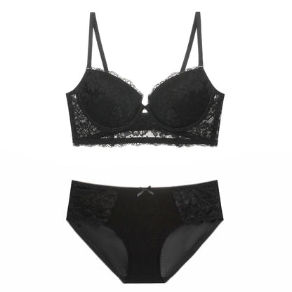 Black lace bra and panties set on a white background