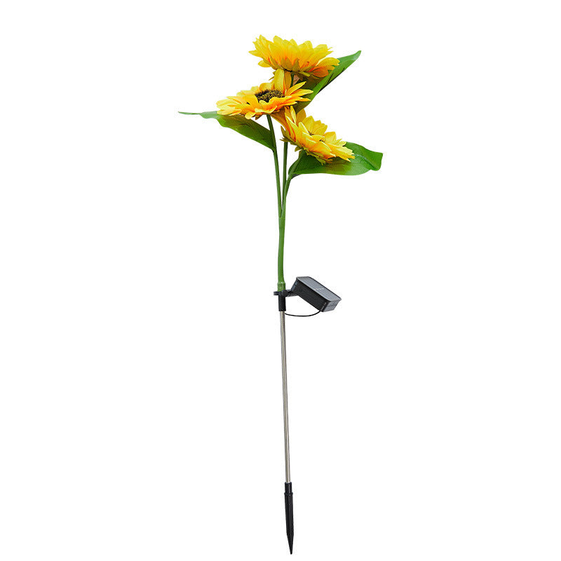 Solar-powered sunflower stake with yellow flowers on a white background