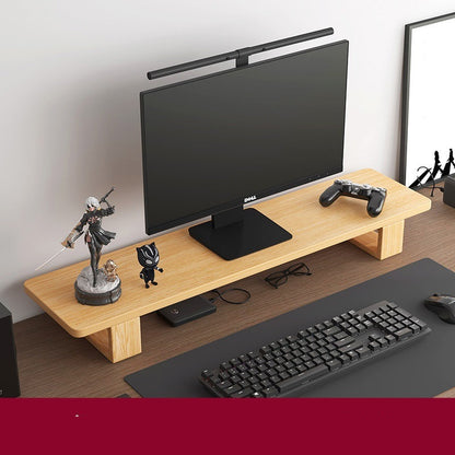 Monitor stand made of black walnut wood, with a computer monitor, keyboard, and various desk accessories on it, placed on a wooden floor against a white background.