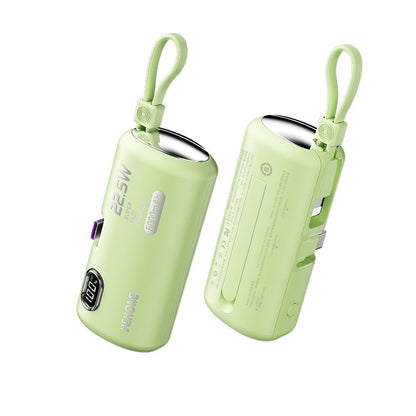 Green power bank with USB ports on a white background