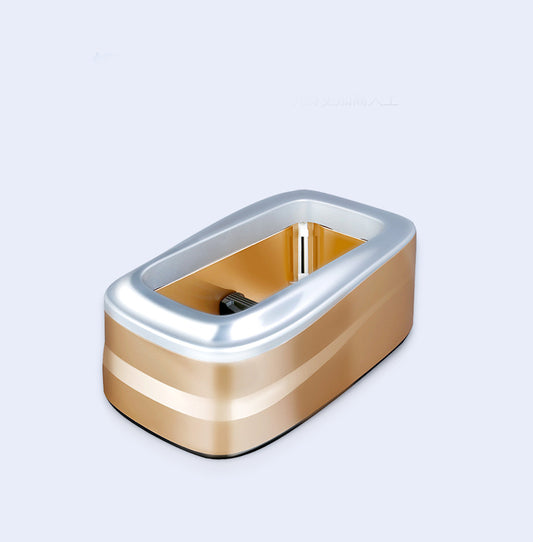 Gold and silver rectangular object on a light gray background