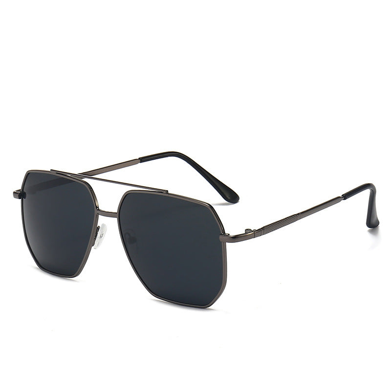 Sunglasses with dark lenses and thin metal frame on a white background