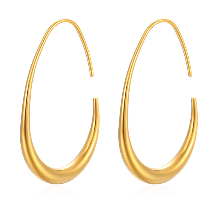 Gold hoop earrings on a white background