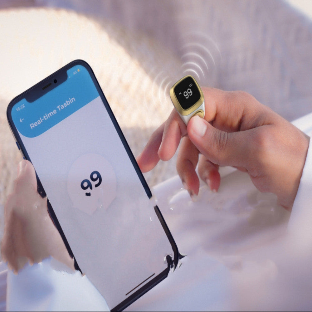 Tasbeeh Smart Counter with smartphone app and hand holding device in water
