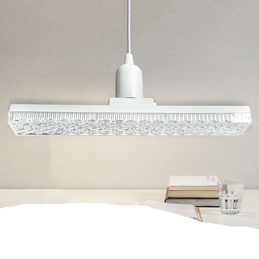 Long crystal lamp hanging above a desk with text about energy-saving lighting.