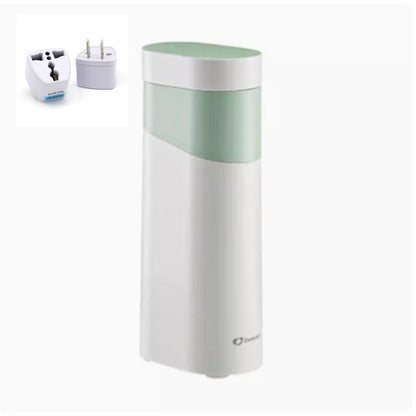 White and green travel mug with a power adapter on a white background