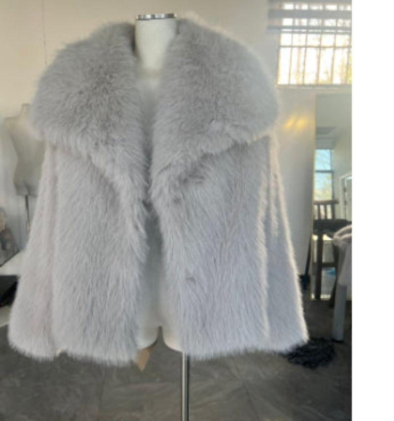 Gray fur coat on a mannequin in an indoor setting