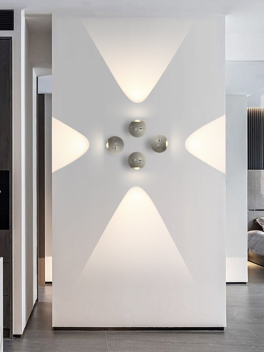 Modern interior design with geometric wall lights and a minimalistic approach.