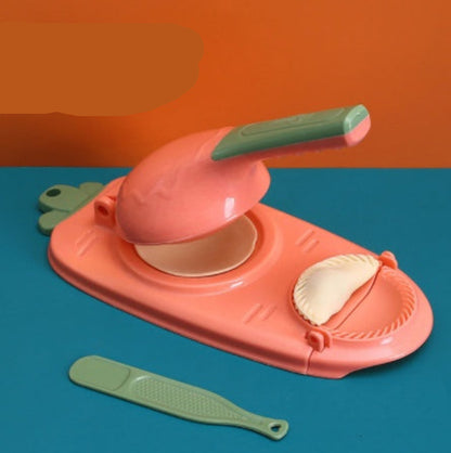 Pink and green kitchen tool on a blue and orange background