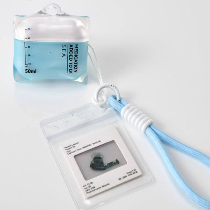 Medication adapter tool with a lanyard on a white background