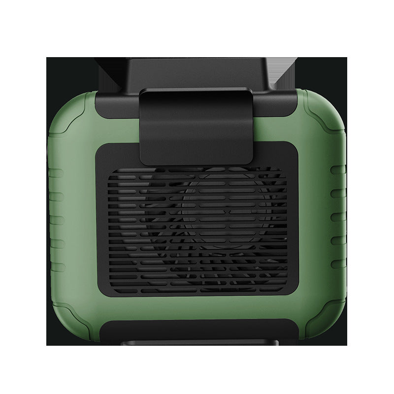 Green and black device with a fan grille on a white background