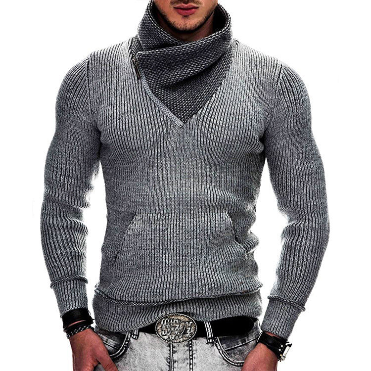 Gray knitted sweater worn by a person on a white background