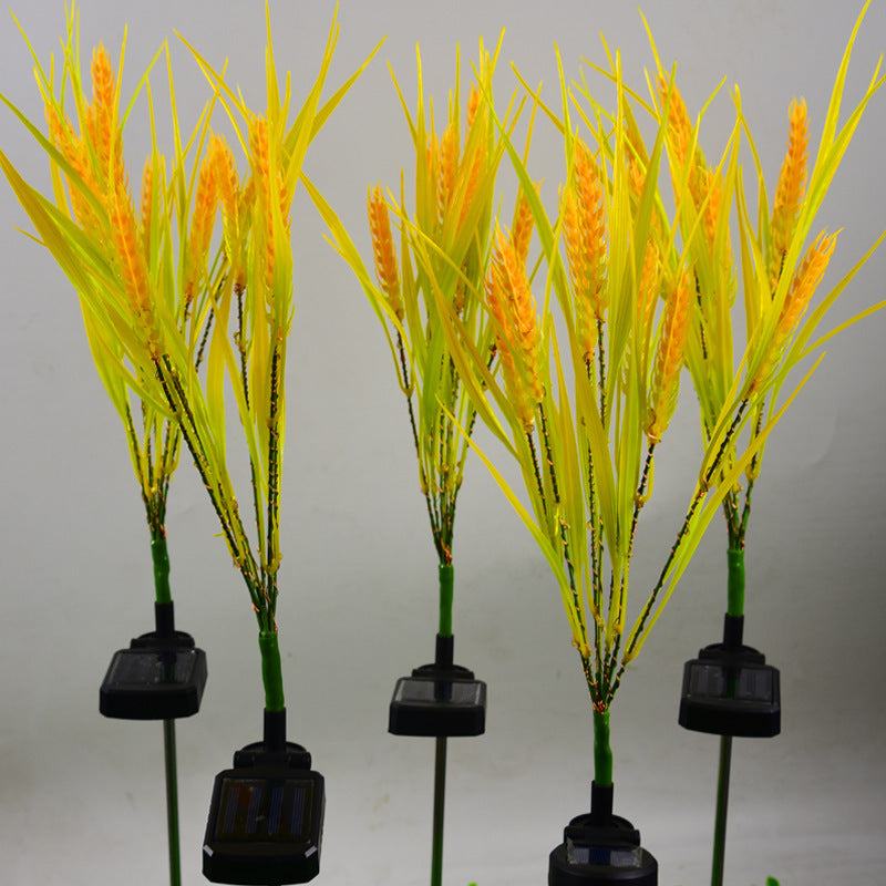 Artificial plants with yellow spikes on a gray background