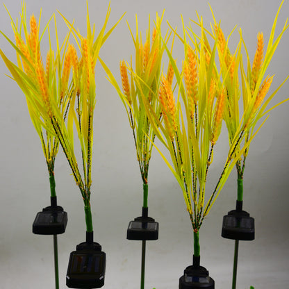 Artificial plants with yellow spikes on a gray background
